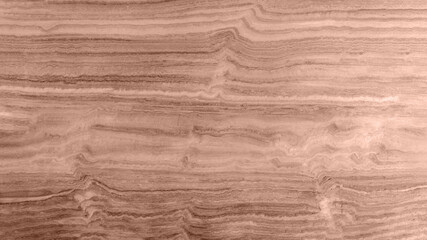 Natural travertine texture in mocha-mousse color, seamless and high-quality background.