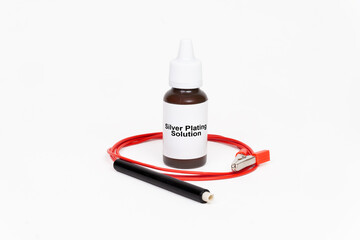 Silver Plating Solution Bottle with Electrode Holder on White Background