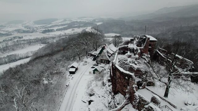Aerial view ruins of old castle. Winter. Ruin of Hohnstein Castle, Harz mountains.