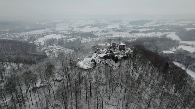 Aerial view ruins of old castle. Winter. Ruin of Hohnstein Castle, Harz mountains.