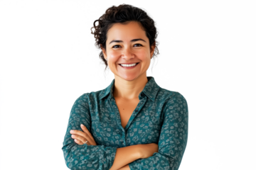 Confident multicultural woman in green polka dot blouse, curly dark hair, arms crossed, smiling professional headshot, isolated PNG with crisp details.
