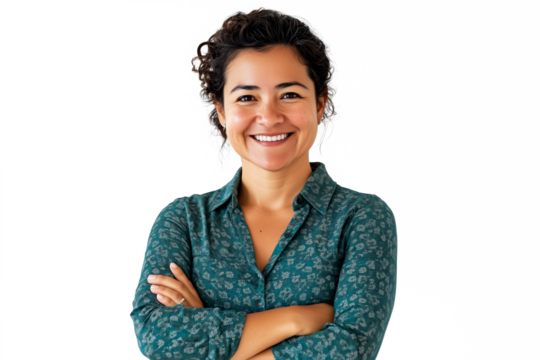 Confident multicultural woman in green polka dot blouse, curly dark hair, arms crossed, smiling professional headshot, isolated PNG with crisp details.
