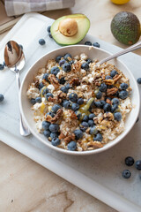 Healthy protein breakfast bowl with cottage cheese, oats, honey and blueberries fresh and homemade