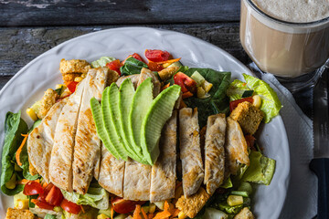 Special house salad with roast chicken.