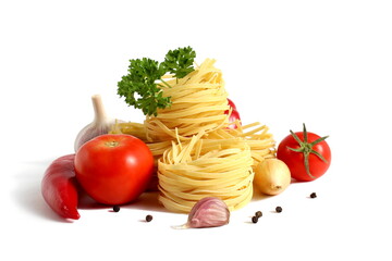 Round spaghetti in the form of a nest with red ripe tomatoes lies on a white background.	