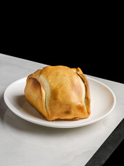 empanadas on a plate on a table in a restaurant