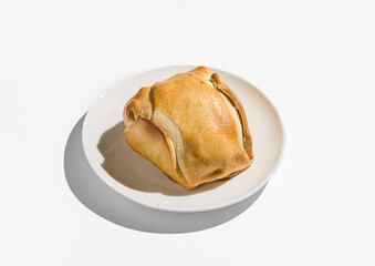 traditional Latin American empanadas on a white plate