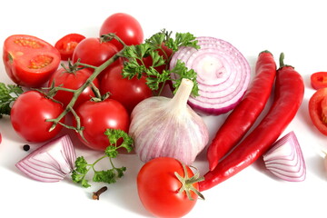 Fresh ripe harvest of vegetables lies on a white isolated background.