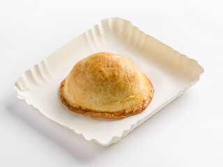 traditional Latin American empanadas on a white cardboard pack for delivery