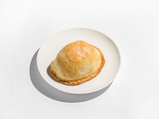 traditional Latin American empanadas on a white plate