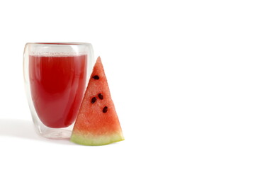  There is a transparent glass with watermelon juice on a white background.