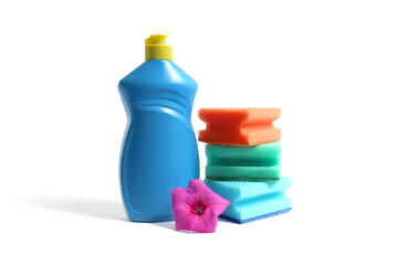 On a white background there is a blue bottle with detergent and sponges for washing dishes.