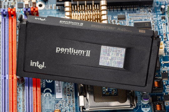 Russia, Moscow - January 11, 2025. Intel Pentium II MMX Slot 1 CPU on a PC Motherboard