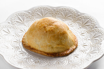 traditional Latin American empanadas on a white plate
