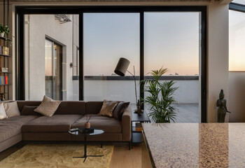 A Modern Living Room Design Featuring a Breathtaking Scenic City View During Sunset