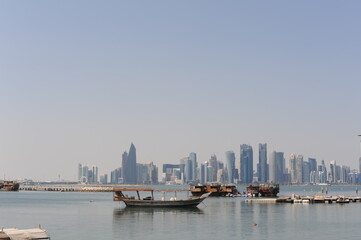 Fototapeta premium Panoramic view of modern skyscrapers of Doha capital city cityscape on a sunny day in summer, Doha, Qatar