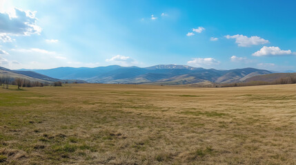 Fototapeta premium Panoramic Countryside with Rolling Green Hills and Bright Sunny Fields in a Tranquil Rural Landscape