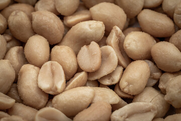 close up of salted peanuts as a background. Toned