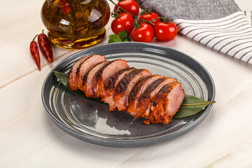 Sliced duck breast baked with cherry