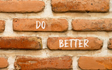 Do better symbol. Concept words Do better on beautiful brown brick wall. Beautiful brown brick wall background. Business and do better concept. Copy space.