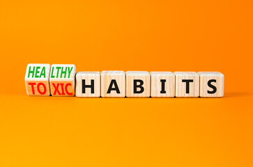 Healthy or toxic habits symbol. Concept words Healthy habits or Toxic habits on beautiful wooden blocks. Beautiful orange table orange background. Business healthy or toxic habits concept. Copy space.