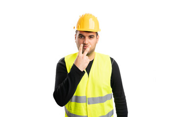 Male builder supervisor pointing fingers as eye contact gesture