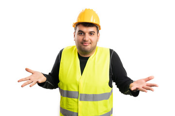 Male construction worker making clueless shrug gesture