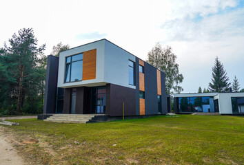 Villa construction. Prefab house under construction. Suburban house Construction. Prefabricated...