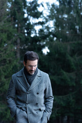 portrait of young man in the woods	