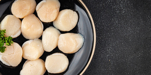 Raw sea scallop seafood fresh tasty food dish gourmet food background on the table rustic food top view copy space keto and paleo diet vegetarian  food pescetarian diet