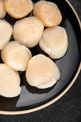 Raw sea scallop seafood fresh tasty food dish gourmet food background on the table rustic food top view copy space keto and paleo diet vegetarian  food pescetarian diet