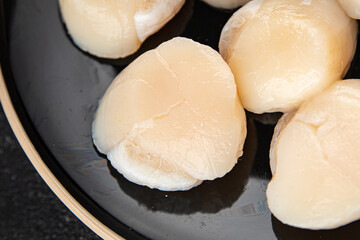 Raw sea scallop seafood fresh tasty food dish gourmet food background on the table rustic food top view copy space keto and paleo diet vegetarian  food pescetarian diet
