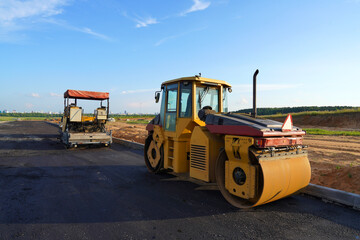 Road Asphalting. Asphalt paving repair. Vibrator compactor machine on roadworks. Asphalt road roller on road construction. Road Construction Equipment. Vibration roller on highway Asphalting.