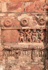 religious carvings on wall of Garh Panchakot Pancharatna temple, also known as Ras Mandir, 16th century Hindu terracotta temple built by Singh Deo dynasty of Panchkot. Now a popular travel destination