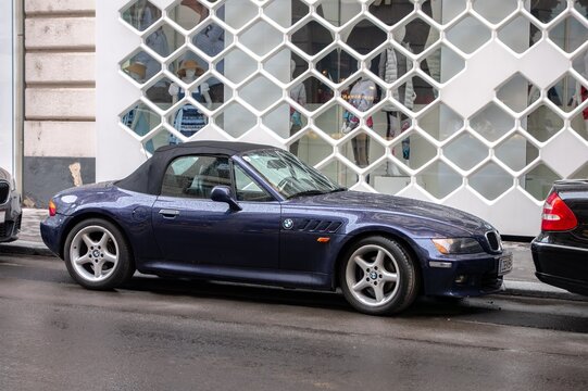 Blue BMW Z3 roadster car parked on street