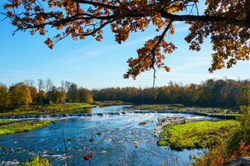 Colorful, picturesque autumn view of the largest European waterfall on the Venta River in Latvia
