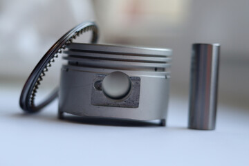 New parts of the cylinder-piston group for the motorcycle: aluminum piston, pin, heat-resistant rings.