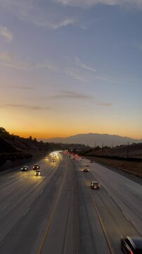 sunset over the highway with traffic