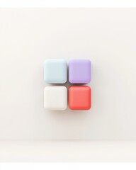 Four colorful, square blocks arranged in a grid against a plain background, showcasing a minimalist design with pastel hues.