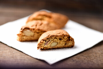 Cantuccini (Italian cookies) on dark wooden background. Close up