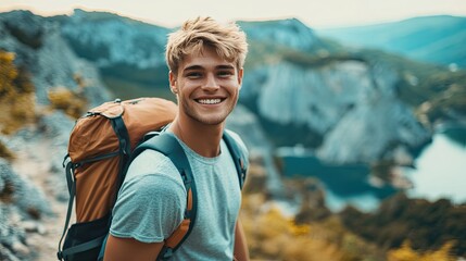 Fototapeta premium Happy hiker smiling during hike in beautiful mountain canyon landscape