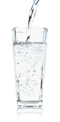 Pouring refreshing soda water into glass on white background