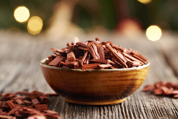 Red sandalwood chips in a wooden bowl