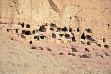 A rock with niches in which Buddha statues once stood in Bamian, Afghanistan