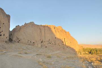 A rock with niches in which Buddha statues once stood in Bamian, Afghanistan