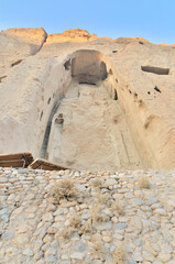 A rock with niches in which Buddha statues once stood in Bamian, Afghanistan