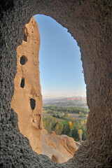 A rock with niches in which Buddha statues once stood in Bamian, Afghanistan