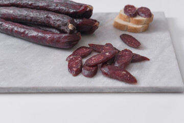 Homemade beef sausage on a light background