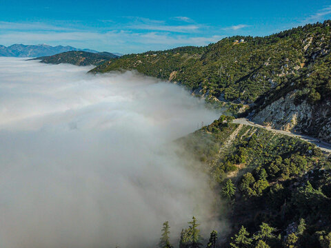Fog against the mountains aerial photo