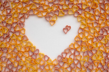 Food love concept.  Pasta hearts on the white background. 